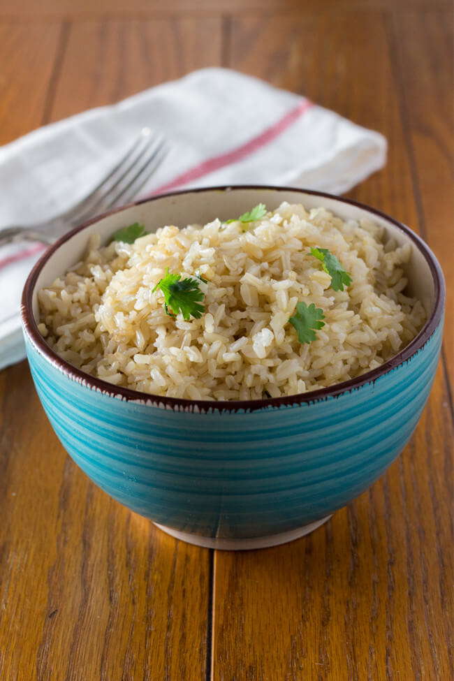 cilantro lime coconut brown rice is an awesome way to jazz but regular brown rice with the addition of lime, cilantro & coconut oil. Make this today!