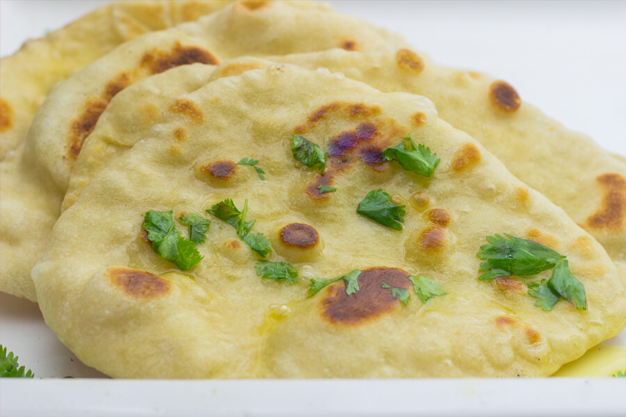 This bread is easily made. Homemade naan is actually similar to a flatbread, but even better. Extra flavor is added from the yougurt and butter. Yum!