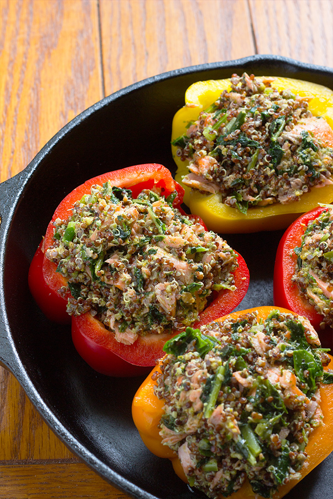 This Salmon Quinoa Stuffed Bell Peppers recipe is the perfect update to any weeknight dinner. Jam-packed with lean protein and vegetable.