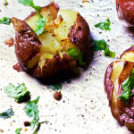 These garlic and thyme smashed potatoes are roasted to crunchy perfection. Coating the potatoes in a garlic thyme butter makes this recipe so flavorful.