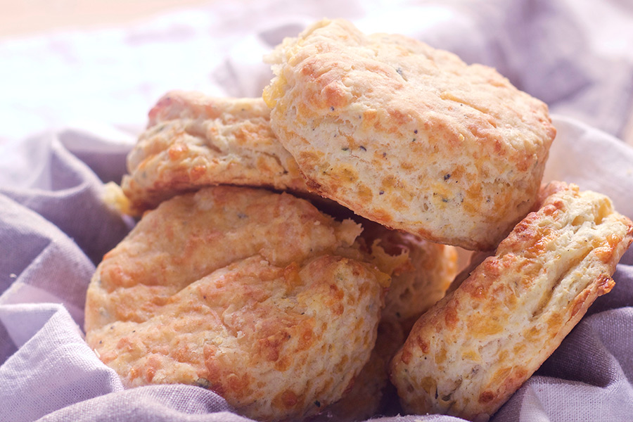 These cheddar thyme biscuits are light, buttery, tangy and cheesey. This recipe is easy to make and guaranteed to impress.
