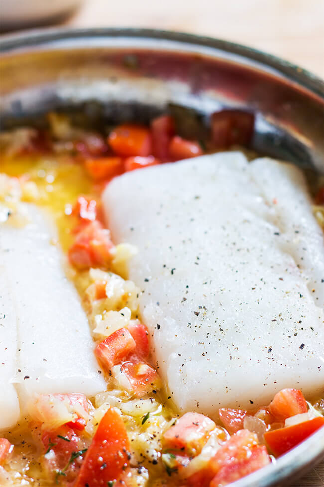 This steamed cod with tomato thyme sauce is the perfect dish year round.the cod is slow cooked it allows the fish to be flaky and buttery every time.