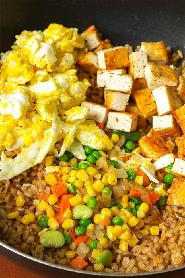I love when I can take a twist on a popular dish. This super easy tofu barley fried rice is a flavorful, filling and can be prepared in 20 minutes. That's faster than take out, not to mention more nutritious.