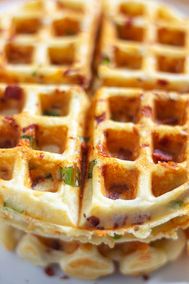 These easy bacon cheese waffle is super crisp on the outside and light on inside. Adding cheese, bacon and scallions makes this recipe perfect anytime.