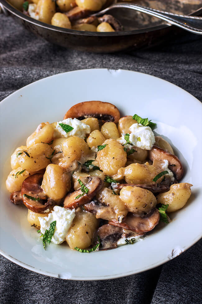 Creamy goat cheese mushroom gnocchi tossed in a creamy tangy sauce. The mint on top of all those over the top flavors makes each bite even more amazing.