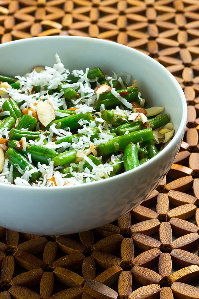 Toasted Almond Coconut Green Beans are deliciously crunchy and when loaded with coconut flakes, almonds and ginger they are out of this world.