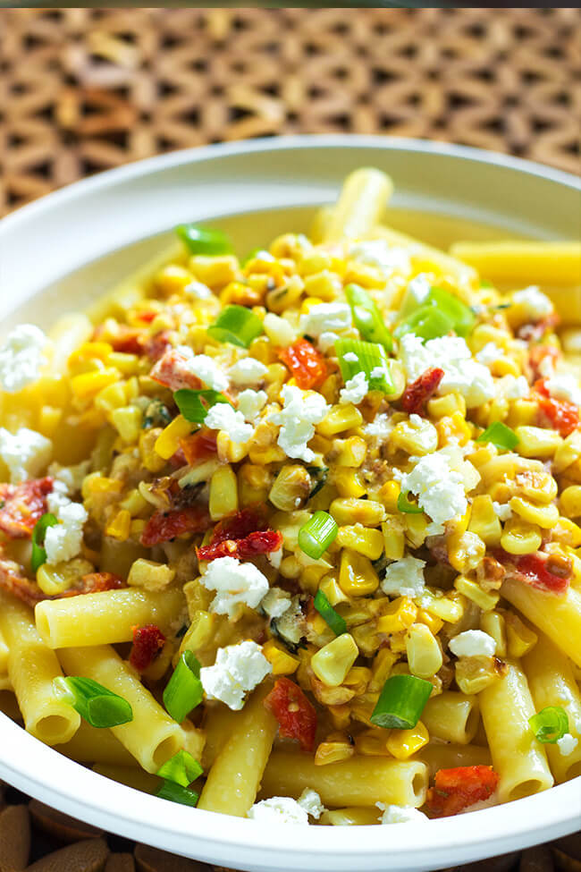 I love Mexican street corn so this what the next step for me, I basically married two of my favorite things- Mexican street corn and Pasta. This roasted corn and tomato pasta is cheesy, creamy, and loaded with flavor.