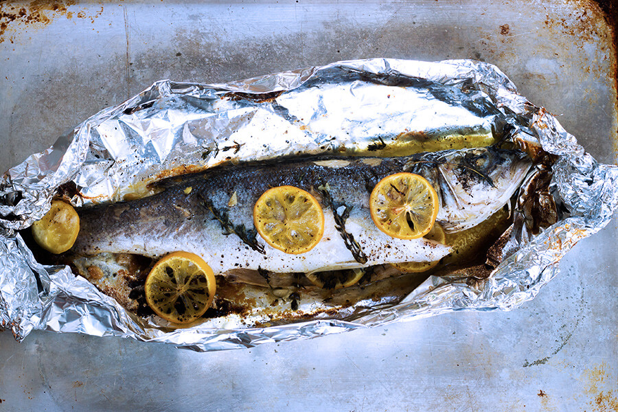 This oven roasted sea bass recipe makes the fish flaky, moist and perfectly seasoned with spices. It is cooked in foil so clean up is a breeze.