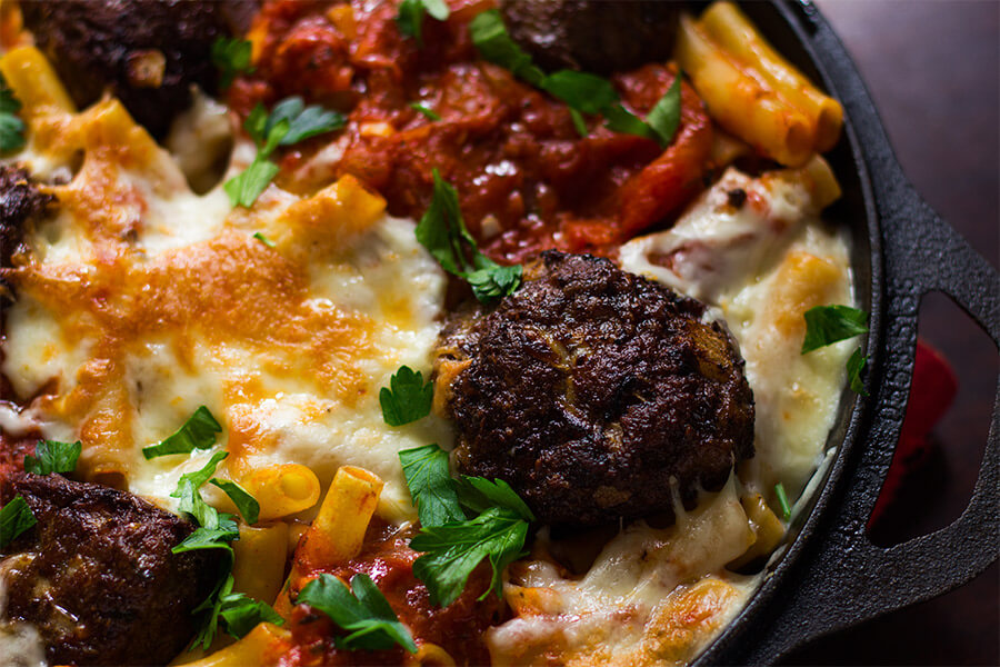 This recipe for giant meatball baked ziti is a must, just knowing that a hot, bubbly pan of delicious baked ziti with giant meatballs is just minutes away