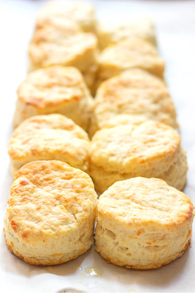 These flaky buttermilk parmesan biscuits are so fluffy and light with the perfect hint of freshly grated parmesan cheese and tangy buttermilk.