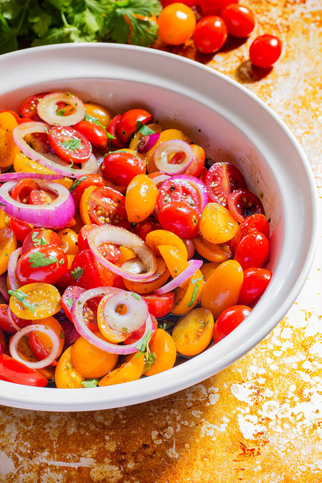 Super easy Balsamic Tomato and Onion Salad recipe that has everything. Sweet and crisp vegetables that are tossed and soaked in a tangy vinaigrette.