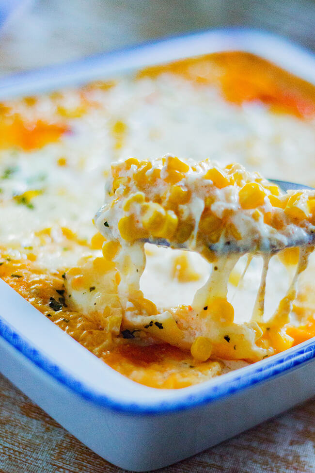 This 4 Ingredient Corn Casserole recipe is so good you'll want to scrape the dish clean to get every last bit. It has fresh corn with cream & tangy cheese.