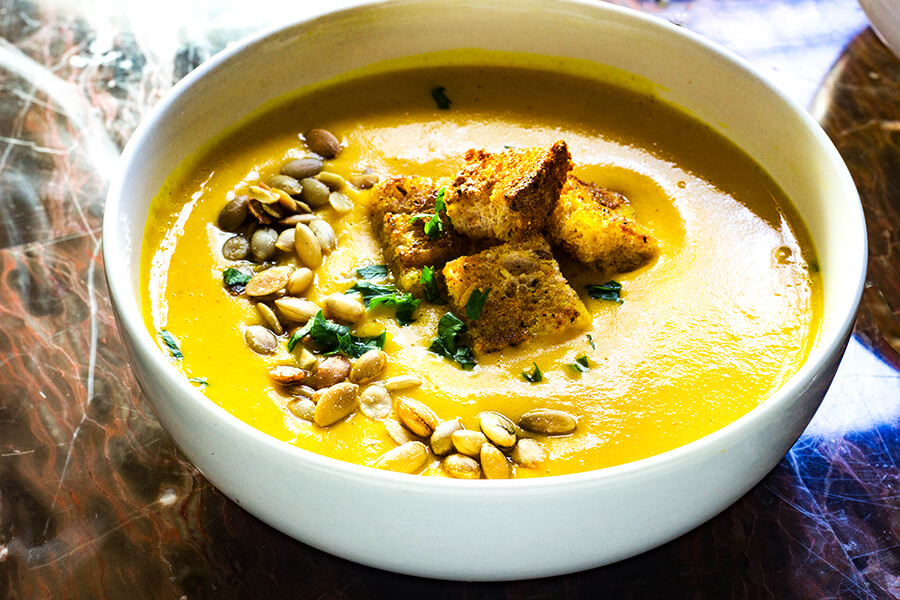 Creamy Curry Butternut Squash Soup is a savory, warming, comforting and simple soup that's the perfect recipe for the fall and winter.