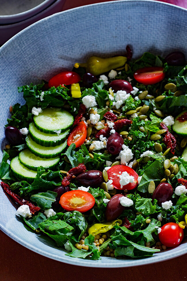 This Minty Kale Greek Salad with Creamy Vinaigrette is the perfect way to pack in all the healthy bright, colorful and flavorful superfoods in a bowl. 