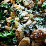 This Sausage Kale and White Bean Stew is the perfect week night dinner for the fall and winter months. Creamy beans, spicy sausage and hearty kale.