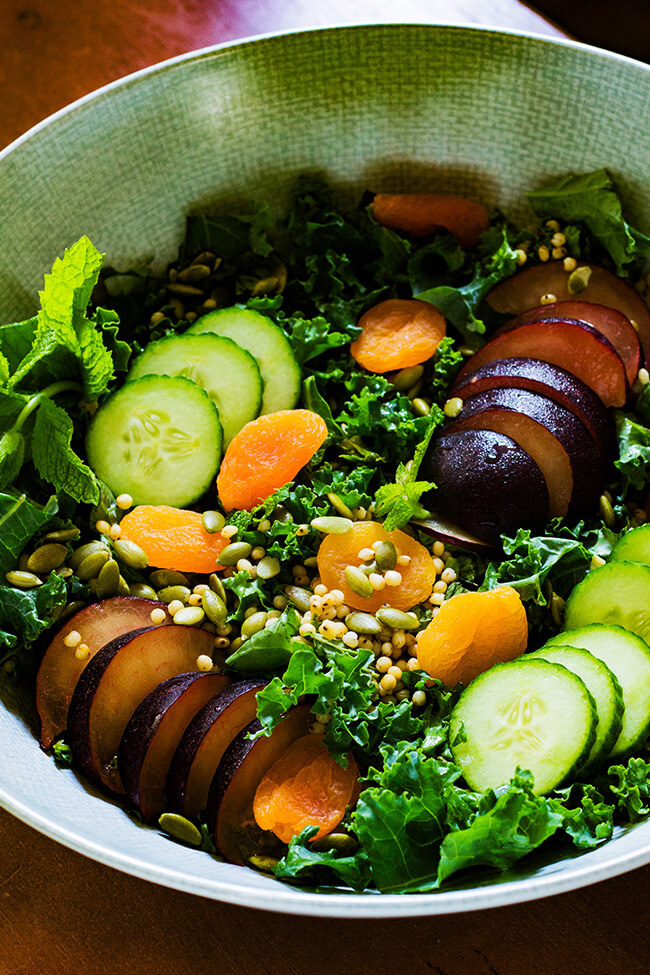 Minty Kale Plum Salad is the perfect end of winter salad. It is bright, herby and jam-packed with different flavors and textures. It can go with any dressing for a easy addition to any meal.