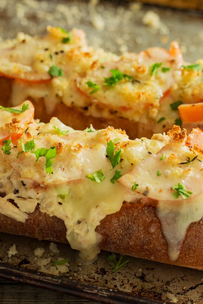 This cheesy Tuna Melt as a lunch or dinner entrée. This tuna melt is filled with creamy tuna salad topped with tomatoes and bubbling cheese that please a small or large crowd.