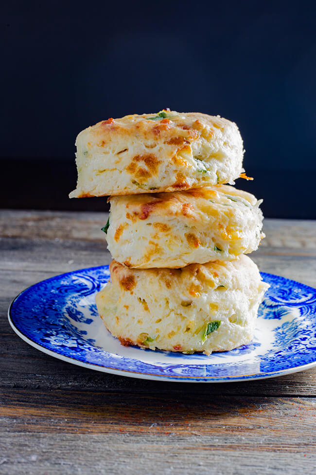 This Cheddar Scallion Biscuits Recipe makes the most tender, delicious, fluffy and cheesy biscuits. It is currently raining cats and dogs in Florida and these made the perfect addition to any soup or stew.